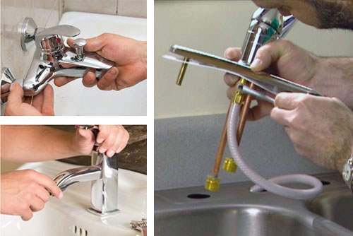 Handyman repairing plumbing under a sink