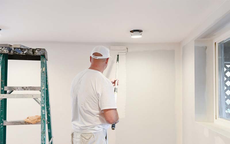 Painter at work on an interior room